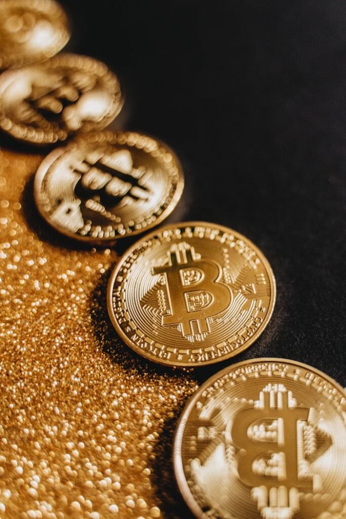 Golden Bitcoins on Gold Glitter Surface